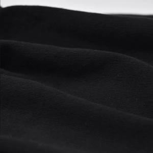 Close-up of black breathable knitted cotton fabric texture for outdoor beanies