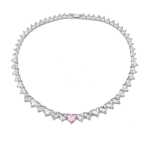 Macro shot of a sparkling necklace with pink heart-shaped crystal and white zirconia stones