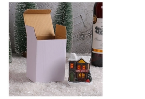 Detailed macro view of resin Christmas fire station miniature house with faux snow texture