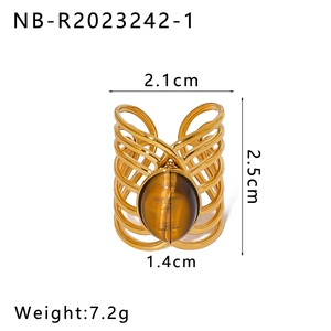 Detailed view of layered gold ring with tiger eye stone and size measurement labels