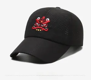 Close-up of a black mesh baseball cap featuring a detailed red lion dance embroidery