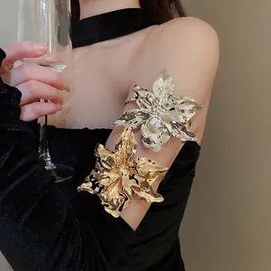 Exaggerated metal flower arm cuff bracelet with high-polish mirror finish in gold and silver