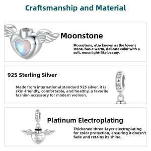 Detailed view of S925 silver heart wing charm with moonstone and forever heart engraving