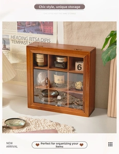 Macro shot of 9-grid wooden storage box with glass lid showing interior partitions