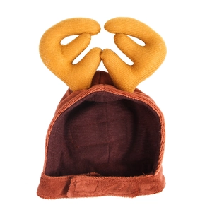 Detail of red Christmas reindeer antler pet hat with corduroy fabric and velcro strap