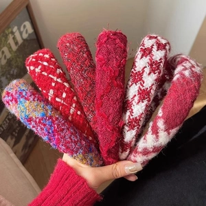 Collection of red tweed and knit headbands for women in festive plaid patterns