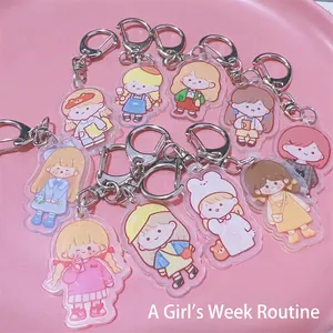 Set of cute cartoon acrylic girl keychains for backpacks and headphone cases displayed on tray