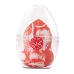Detail of marble pattern beauty blender sponge with a clear protective egg-shaped case