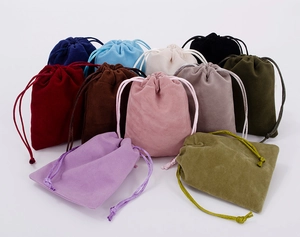 Various colored velvet drawstring pouches for jewelry storage shown in a group shot