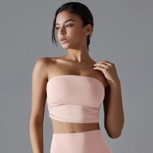 Detail of ruched sides on dusty pink strapless sports bra in high elastic fabric
