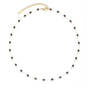 Minimalist gold titanium necklace featuring black faceted stone beads on a delicate chain