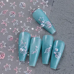 3D ocean nail stickers featuring jellyfish and starfish on sparkling blue manicure