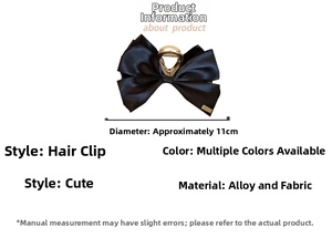 Detail shot of black satin bow hair claw clip with 11cm diameter measurement