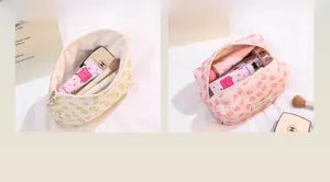Lace cosmetic bags with yellow daisy and pink floral patterns and shell zipper pull