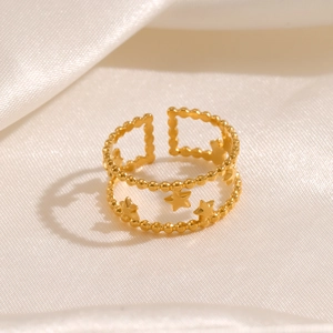 Elegant 18K gold-plated double-layer star ring with adjustable band on silk background