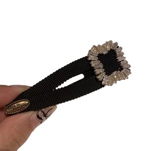 Black ribbon Y2K hair clip featuring square rhinestones and Love is Forever metal plaque