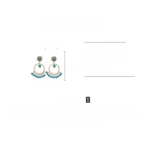 Detail view of bohemian gold tassel earrings with blue stones and rhinestones, 7.5cm long