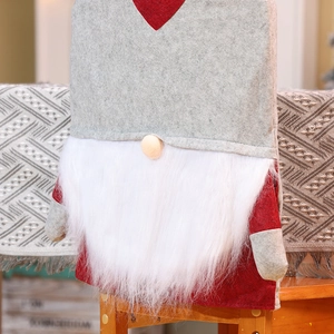 Detailed view of Christmas gnome chair covers featuring soft plush beard on a wooden stool