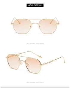 Detail of gold double-bridge sunglasses with brown gradient lenses and octagonal frames