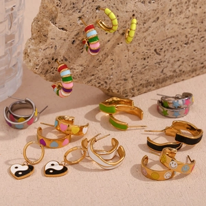 Detailed arrangement of gold-plated geometric earrings with colorful enamel and charms