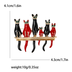 Detail view of colorful enamel cats brooch with precise size and weight measurements