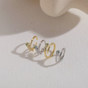 Luxurious snake rings with sparkling white cubic zirconia and green gemstone eyes in gold