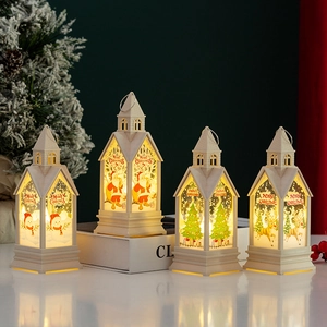 Detail of festive Christmas lantern with Santa pattern and warm white LED glow