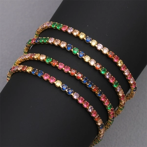 Close-up of multicolored tennis bracelets with 18K gold plating on a jewelry display stand