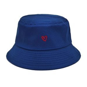 Close-up of heart embroidery on navy cotton bucket hat with detailed stitching