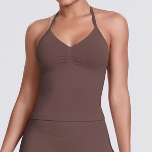 Detail of seamless halter yoga top with gathered chest and rib-knit chocolate fabric