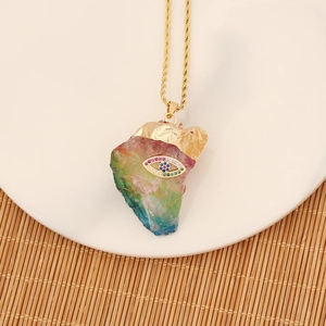 Detailed view of evil eye crystal pendant on a gold necklace with zircon stones
