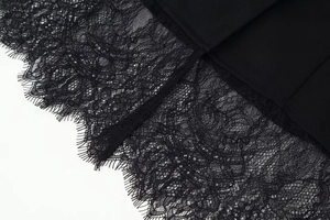 Detail of elegant black lace patchwork and high-quality woven fabric on long sleeve jacket