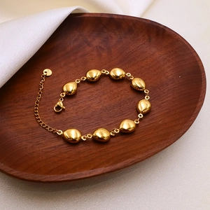 Detail of 18k gold plated stainless steel teardrop bead bracelet with lobster clasp