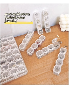 Detailed view of clear acrylic anti-oxidation jewelry storage boxes for earrings and rings
