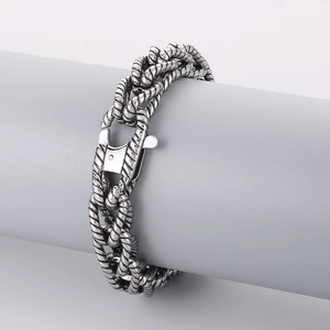 Macro view of vintage punk braided stainless steel chain bracelet with lobster clasp