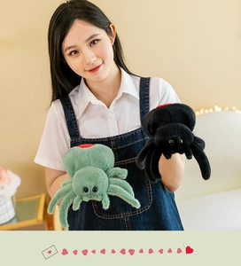 Model posing with soft plush spider toys in green and black colors for kids