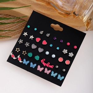 Detailed set of 20 pairs of cartoon alloy stud earrings on black card display