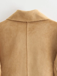 Close-up of back neckline and middle seam on a camel suede fashion jacket for women