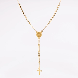 Macro detail of gold stainless steel rosary necklace with St. Benedict medal and cross