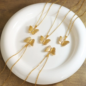 Golden butterfly necklace with sparkling zircon pavé on thin stainless steel chain