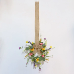 Floral wreath with pink, yellow, purple flowers and linen bow on a white background