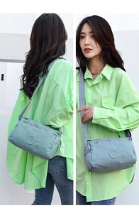 Detailed views of a light blue nylon crossbody bag shown from front and back on a model