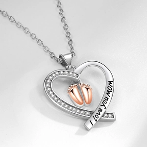 Silver heart necklace with rose gold baby feet pendant and I love you mom engraving