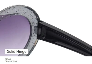 Detail shot of solid metal hinges on heart-shaped kids sunglasses with glitter frames