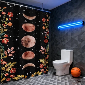 Detail of moon phase shower curtain with red floral patterns in a modern dark bathroom
