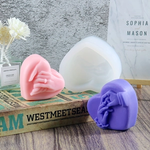 Heart-shaped silicone mold featuring hand-holding relief for scented candles and soap