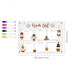 Macro shot of acrylic Christmas wish list board with colorful markers and gnome illustrations