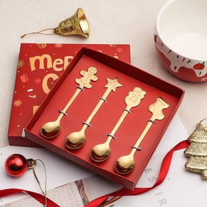 Christmas 4-piece golden stainless steel spoon set with festive charms in a red gift box
