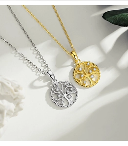 Macro detail of S925 sterling silver Tree of Life pendants with cubic zirconia accents