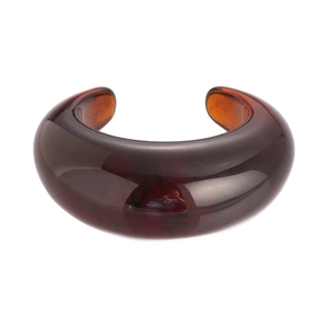 Chunky amber resin cuff bracelet with a vintage round open design and marbled texture